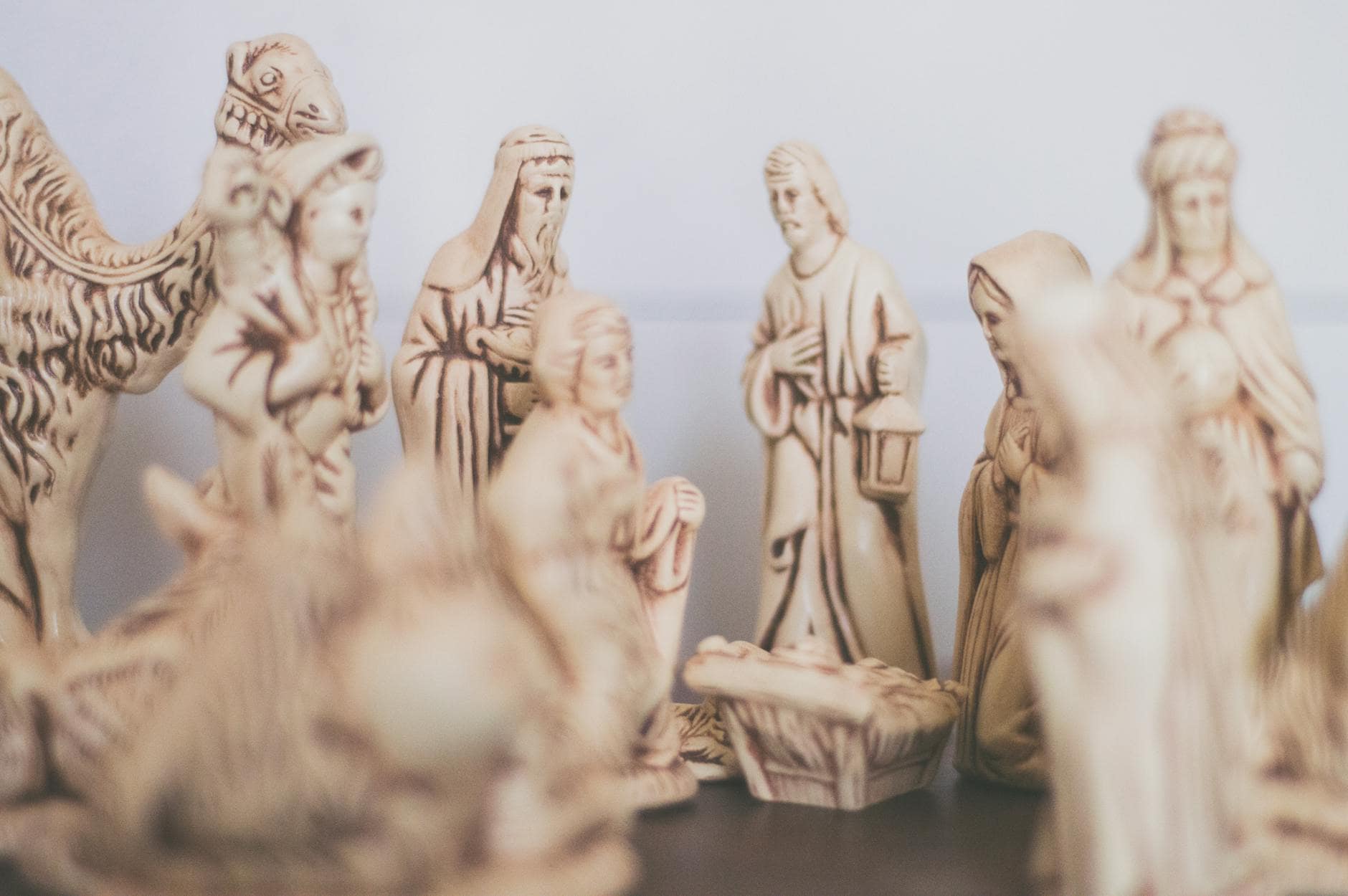 shallow focus photography of religious figurines
